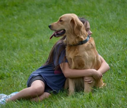 Girl hugging dog