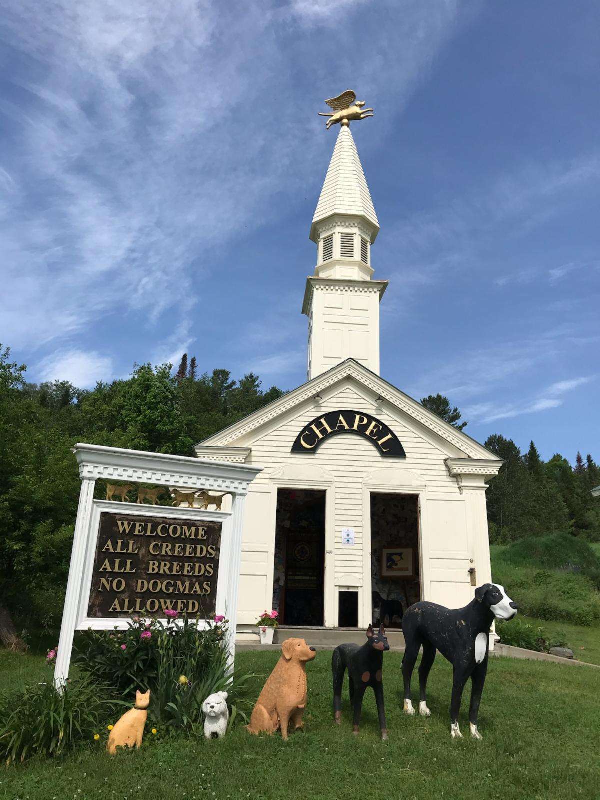 Dog chapel with dog angel on top of the steeple